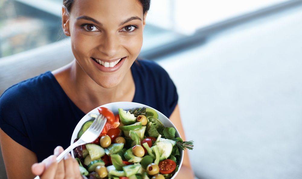 A woman eating a salad