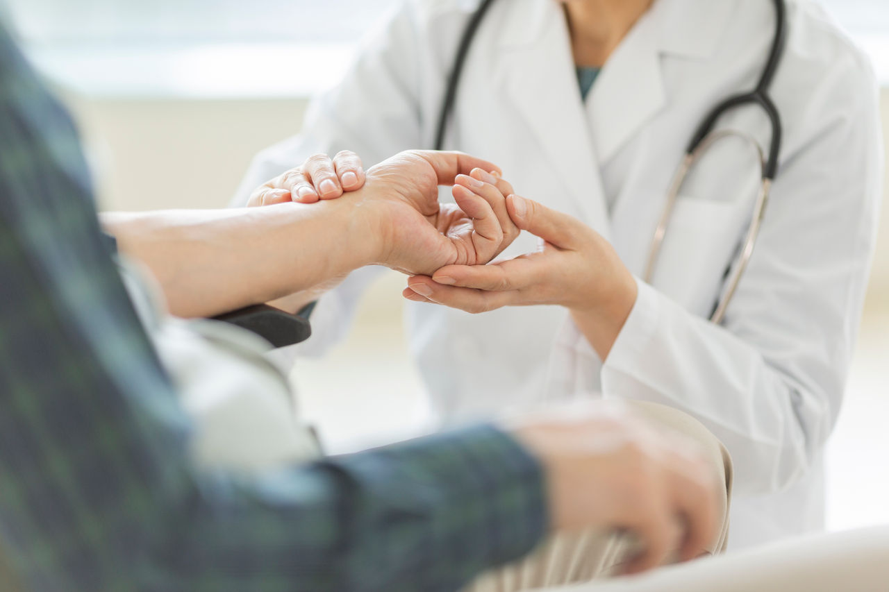 An orthopedic surgeon examines a painful wrist.