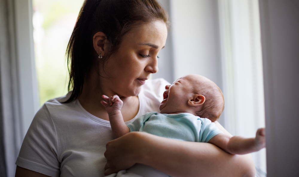 A woman holding an infant