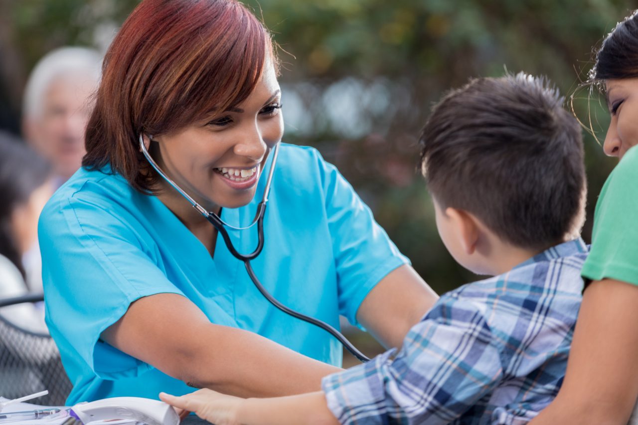 Physician provided charity health care to a happy child.